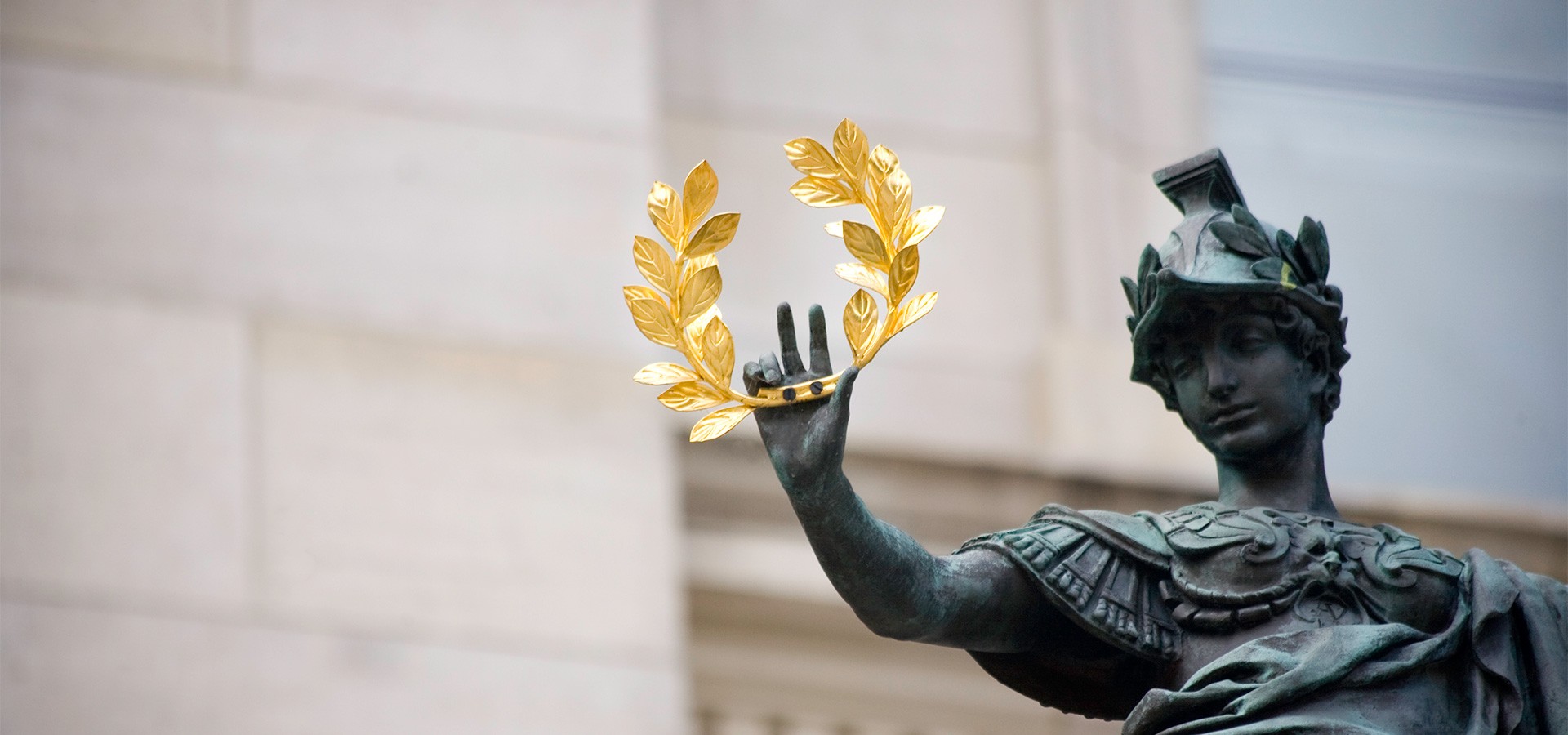 Statue holding laurel wreath