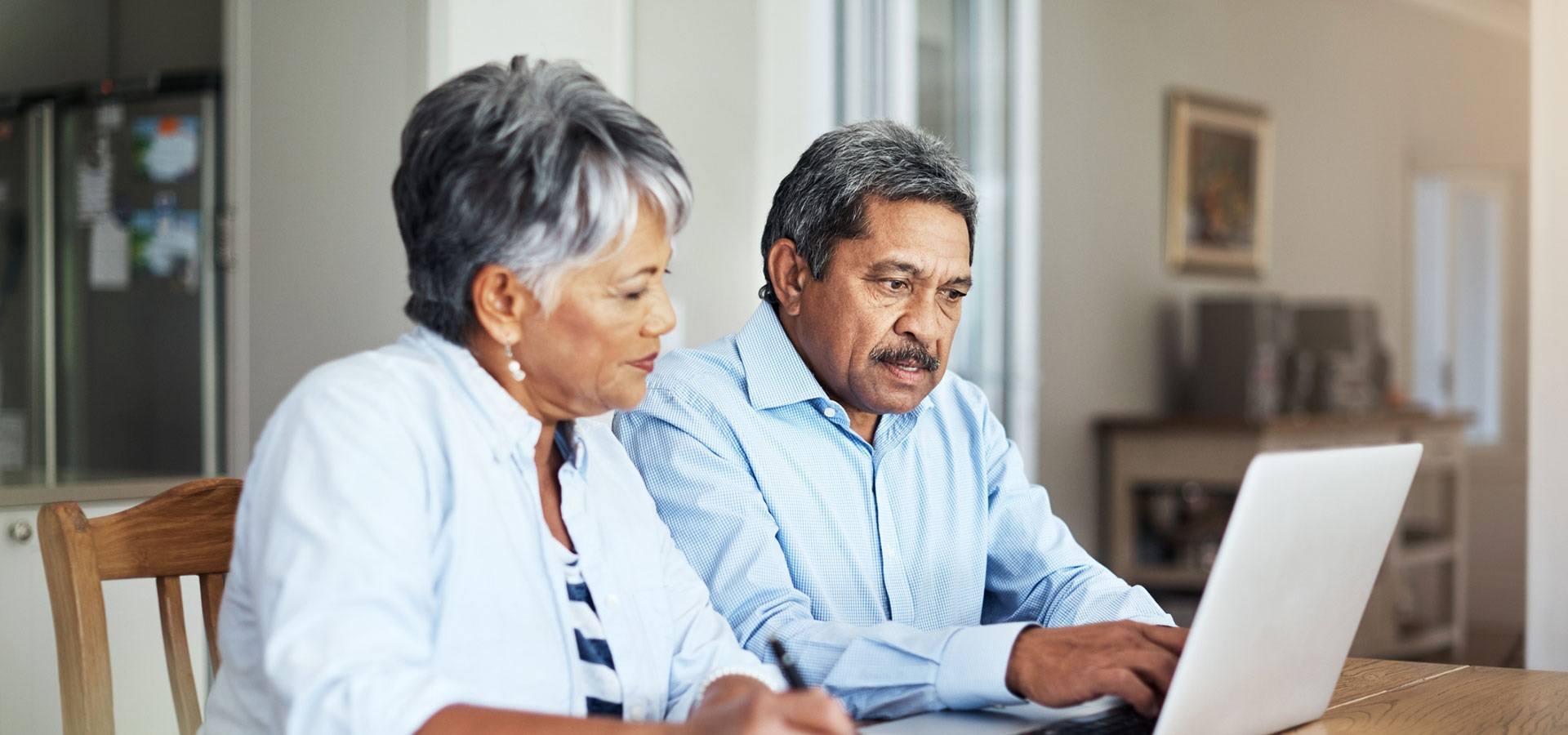 Man and Women looking at laptop screen