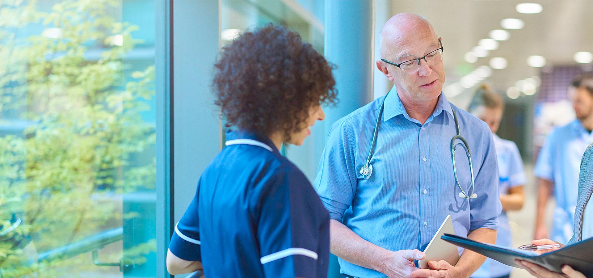 Physicians talking in hallway