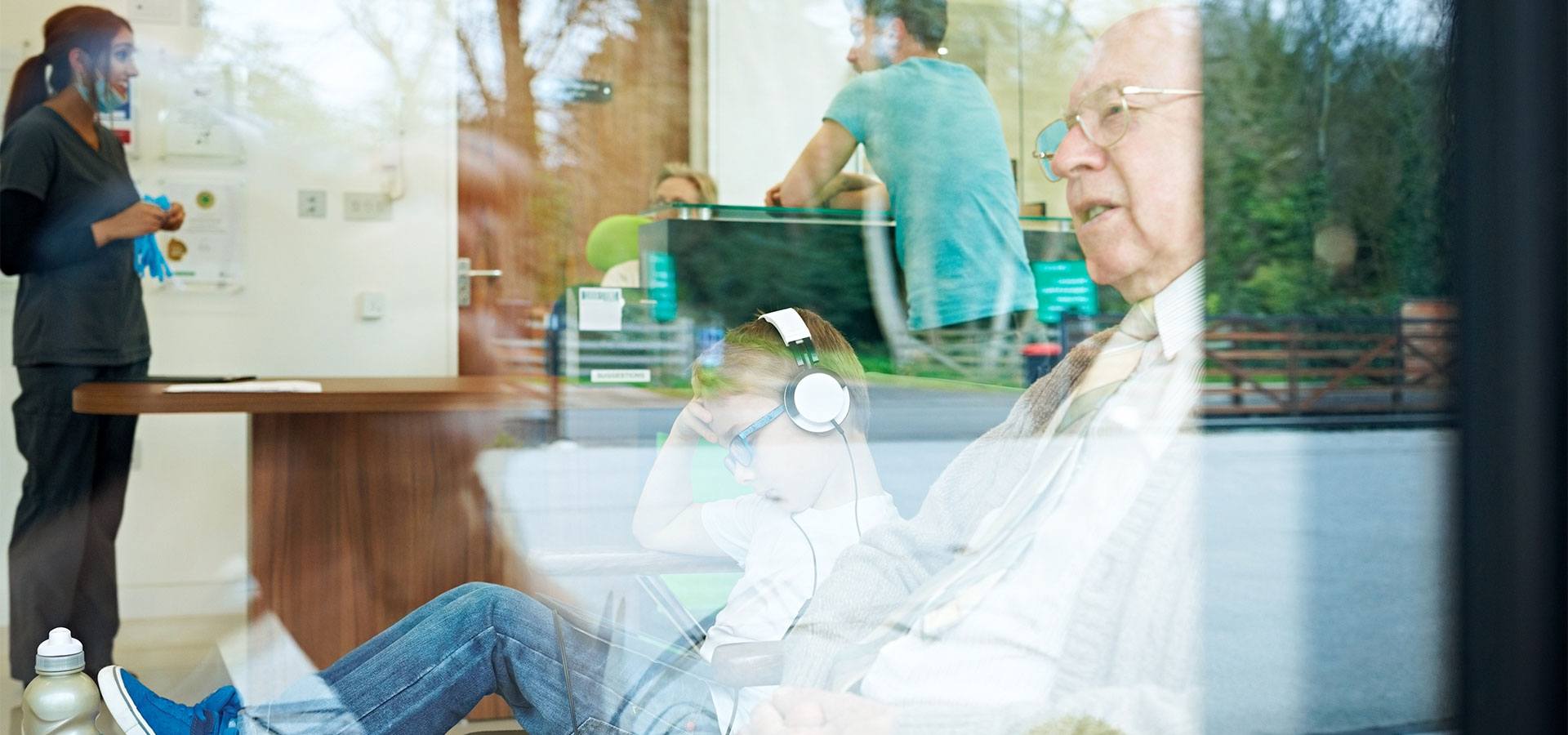 older gentleman and young kid in waiting room