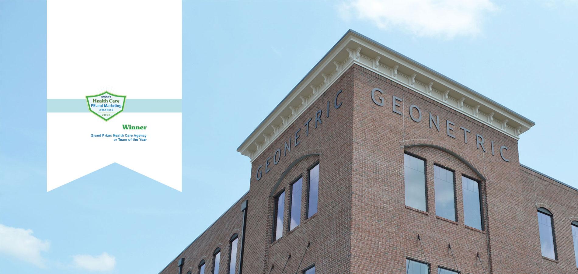 Geonetric building with banner displaying award for grand prize: Health Care Agency or Team of the Year