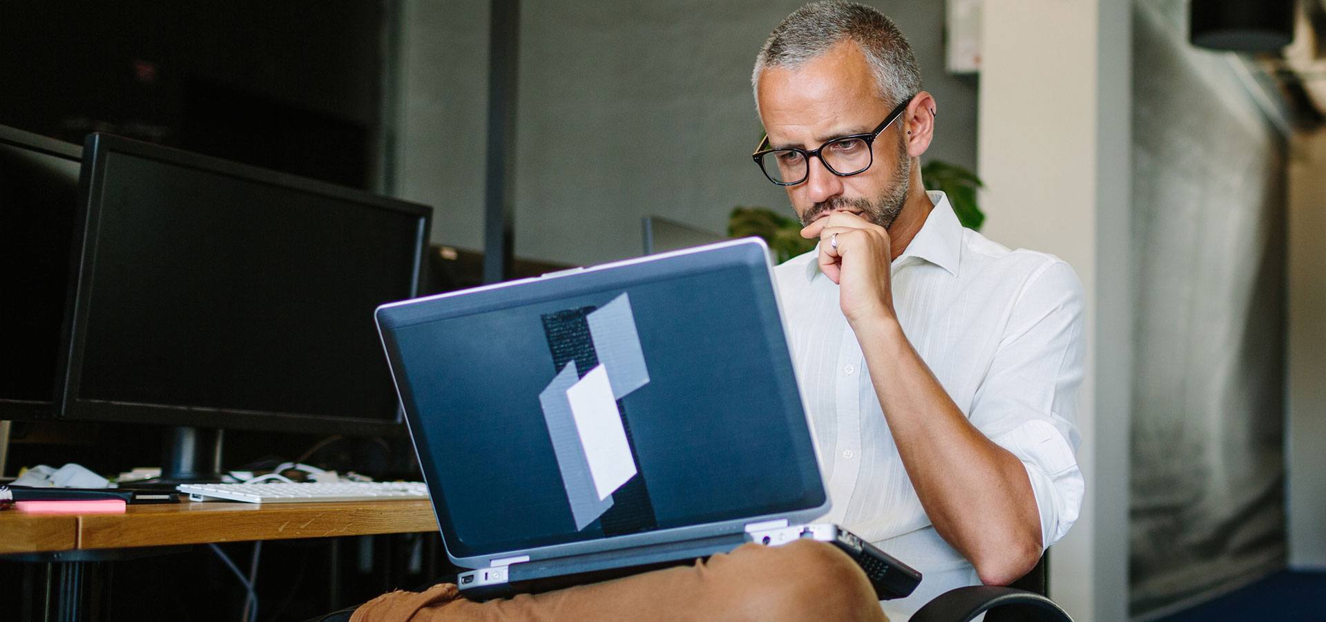 man on laptop in office