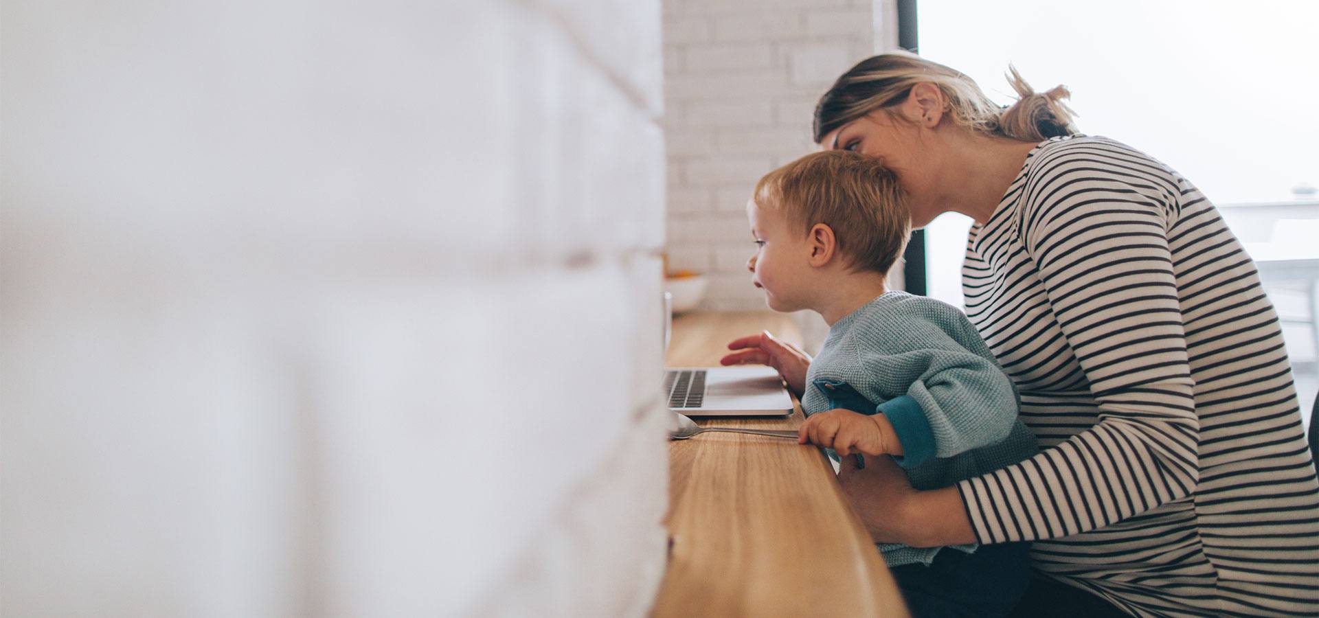 mother and son on laptop