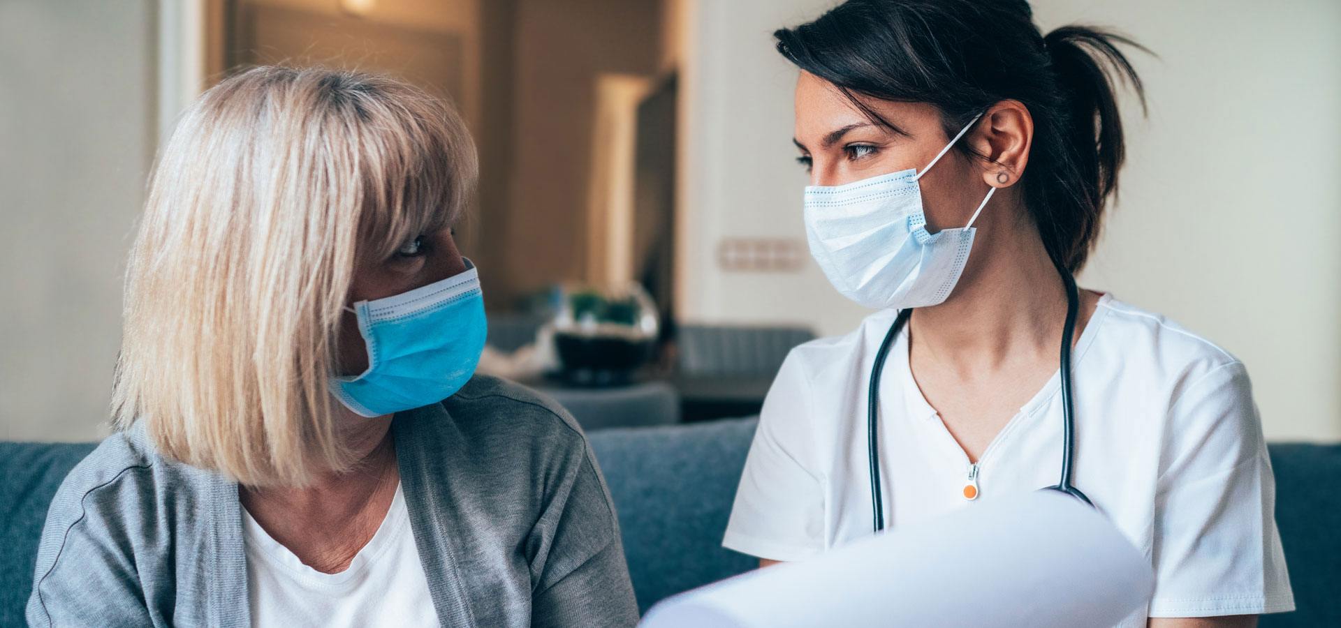 Doctor and patient wearing masks