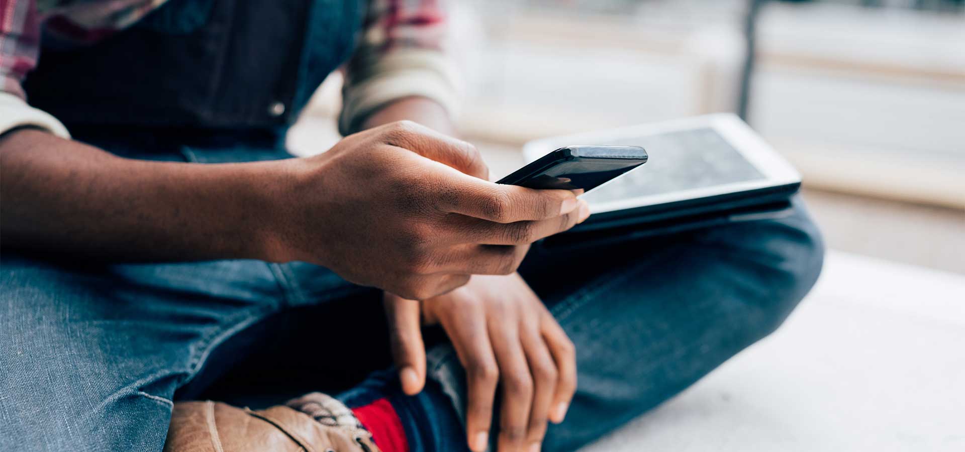 young man holding mobile phone