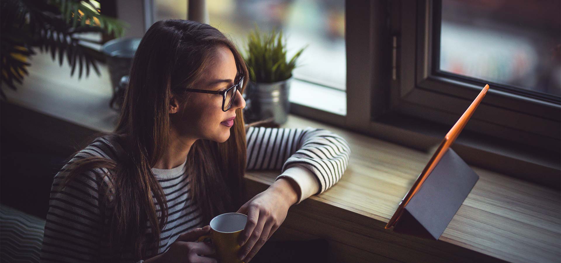 woman reading tablet