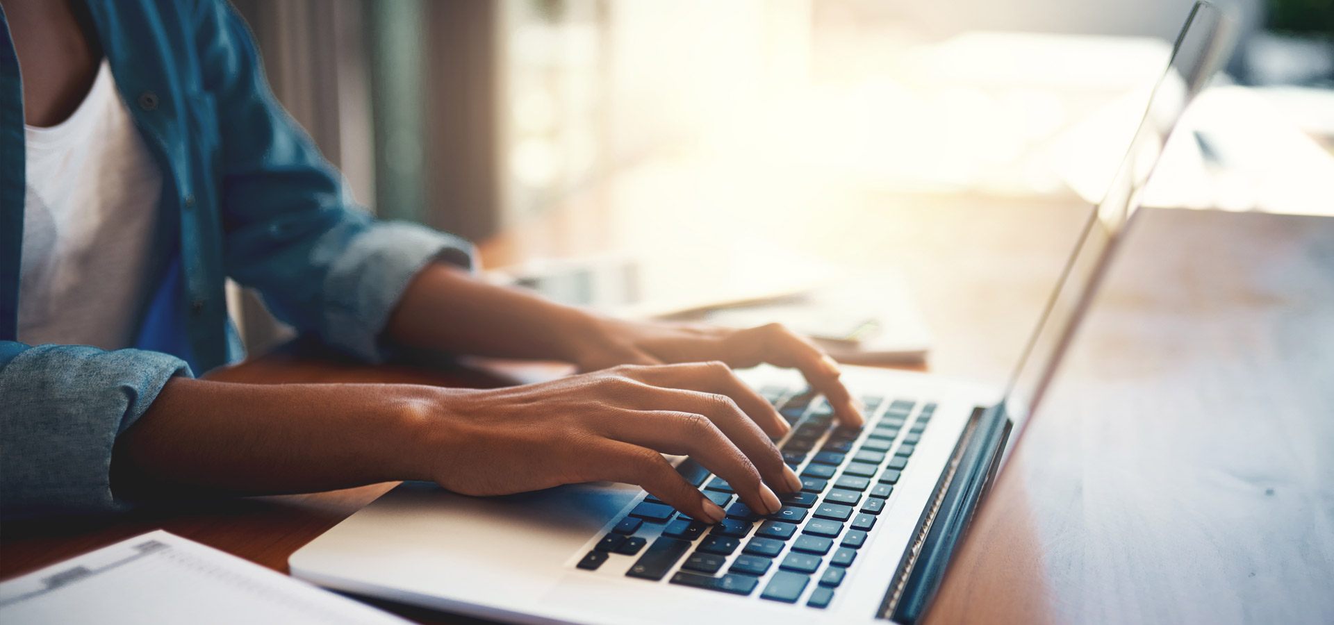 Woman typing on laptop