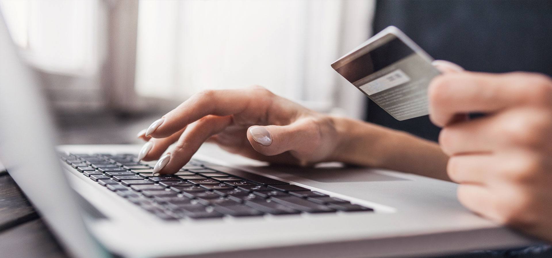 Woman is shopping online with laptop