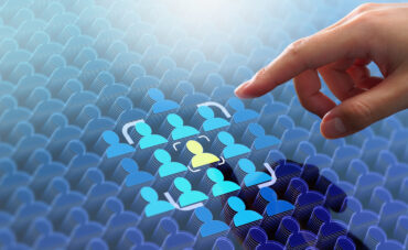 Marketer pointing at a highlighted consumer icon in a sea of icons
