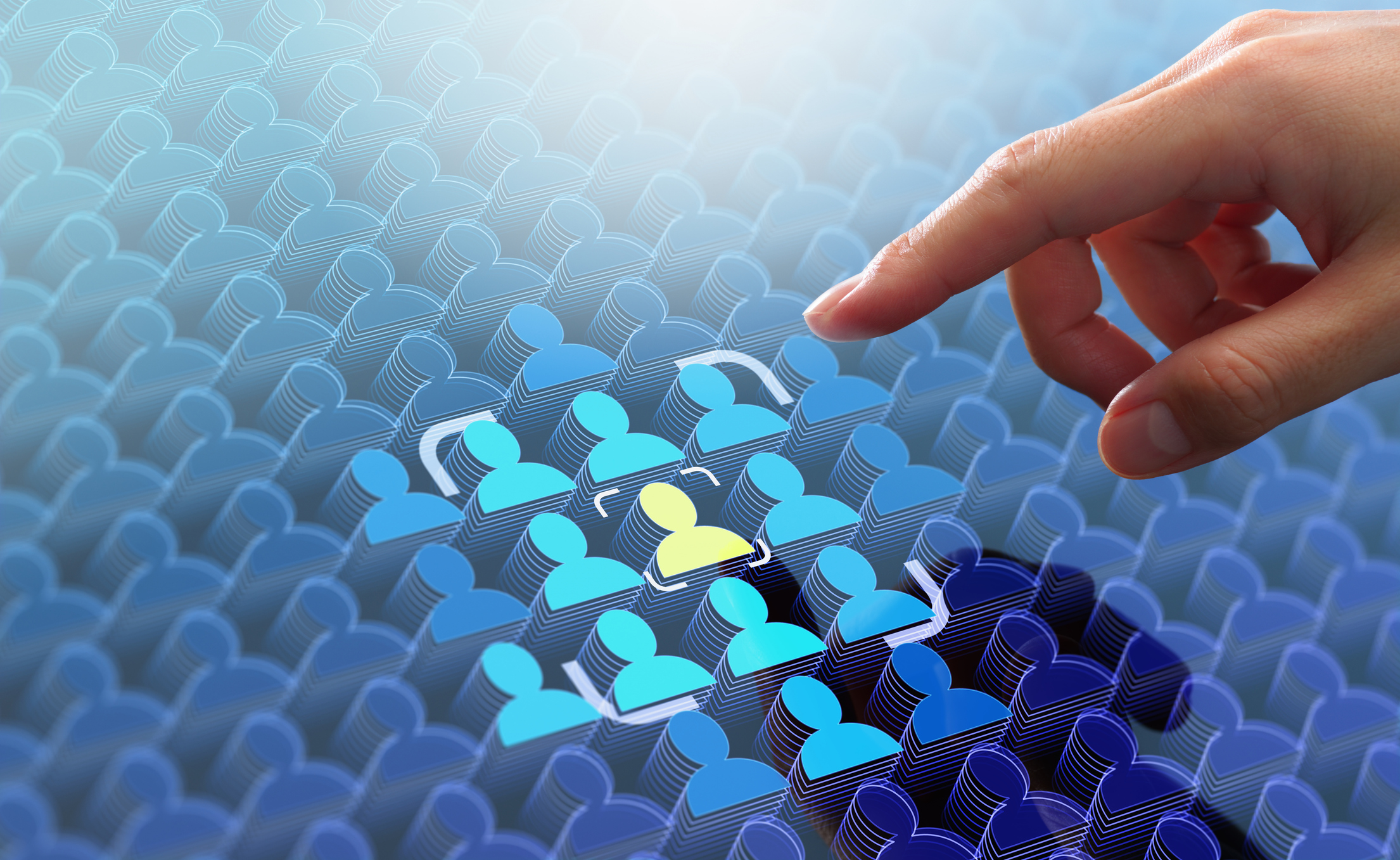 Marketer pointing at a highlighted consumer icon in a sea of icons